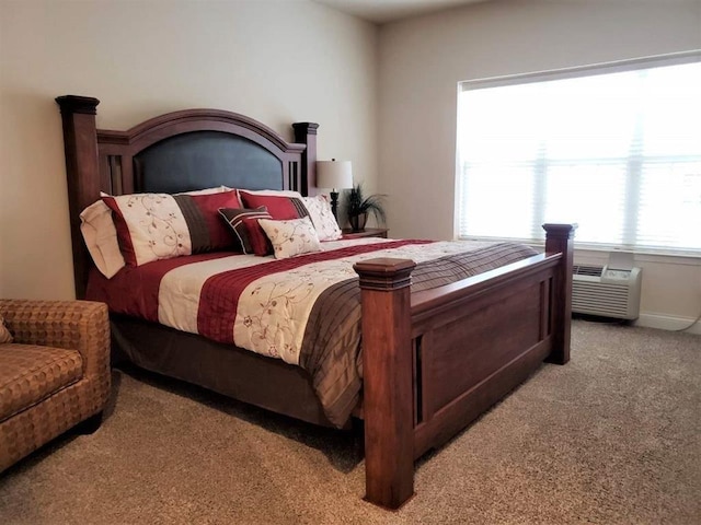 carpeted bedroom with a wall unit AC