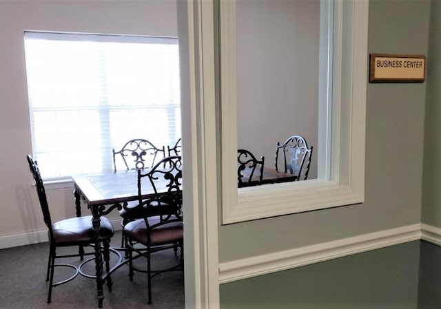 view of carpeted dining area