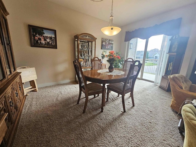 dining space featuring carpet floors