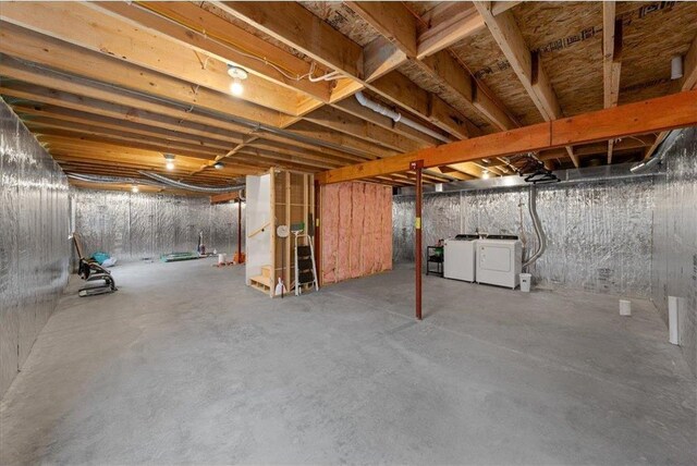 basement with washing machine and clothes dryer