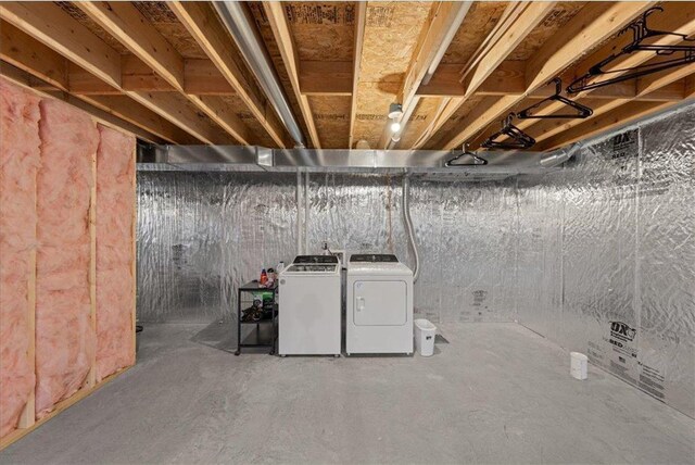 basement with washing machine and clothes dryer