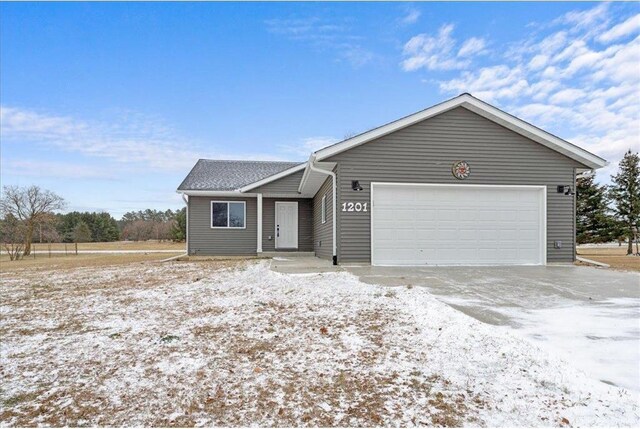 single story home featuring a garage