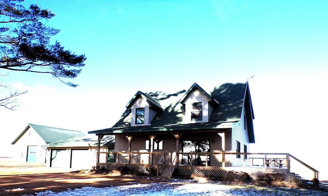 view of front of home with a garage and covered porch