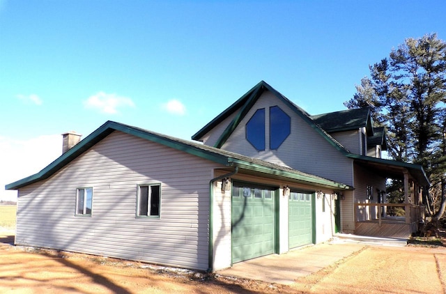 view of side of home with a garage