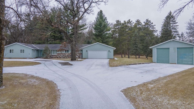 view of front of home with an outdoor structure and a garage