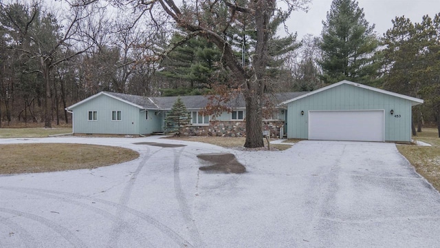 ranch-style house featuring a garage