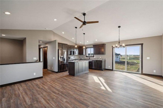 kitchen with stainless steel refrigerator with ice dispenser, dark brown cabinetry, a center island, hanging light fixtures, and dishwashing machine