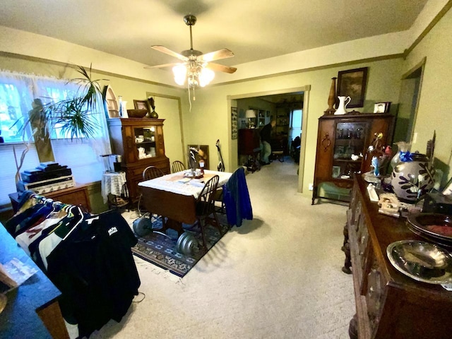 dining area featuring carpet floors and ceiling fan