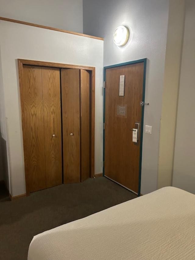 carpeted bedroom with a closet