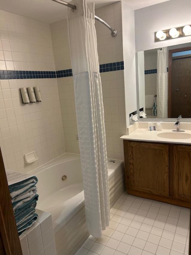 bathroom with vanity, tile patterned flooring, and shower / bathtub combination with curtain