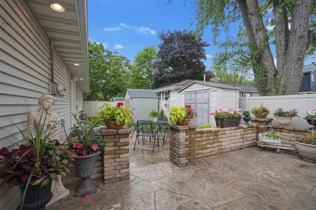 view of patio featuring a storage unit