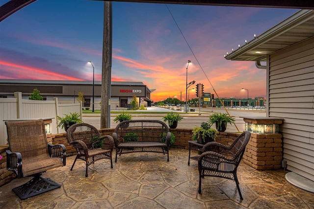 view of patio terrace at dusk