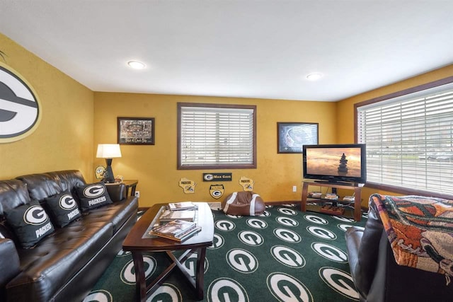 carpeted living room with a wealth of natural light