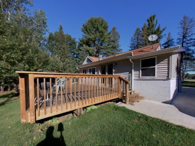 rear view of property featuring a deck