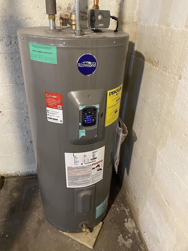 utility room featuring electric water heater