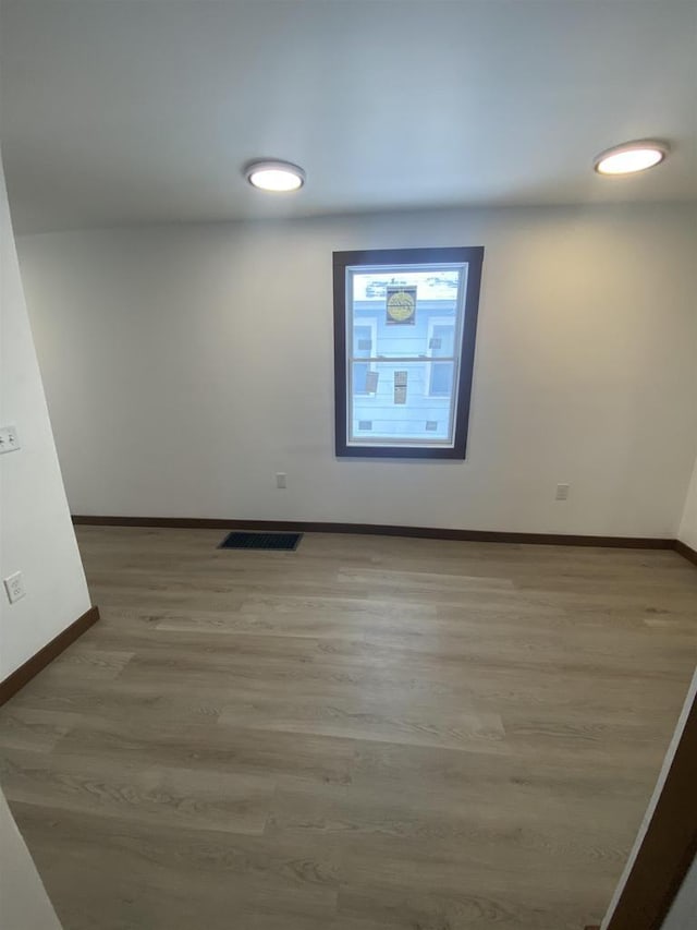 unfurnished room featuring wood-type flooring