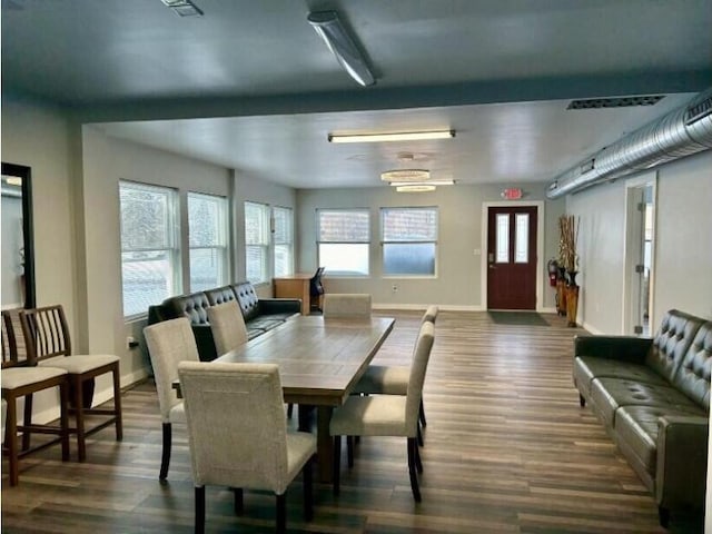 dining space featuring dark hardwood / wood-style floors