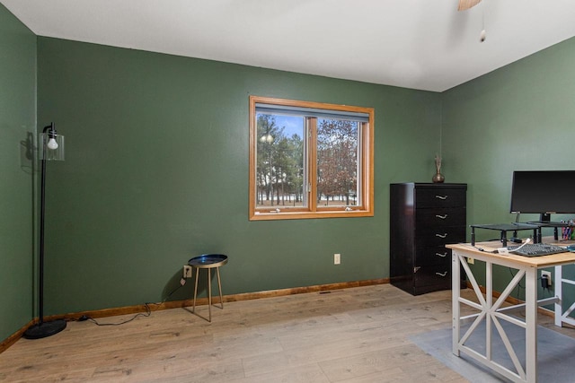 office area with light hardwood / wood-style flooring and ceiling fan