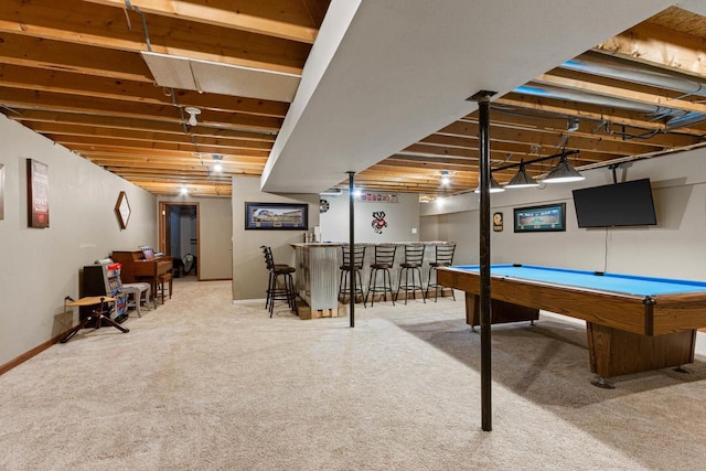 game room with carpet, pool table, and bar area