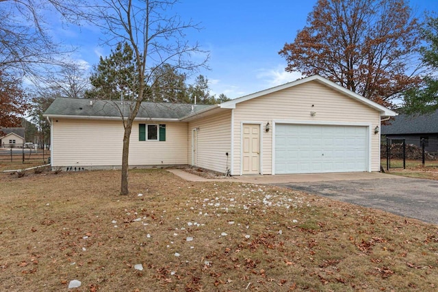 rear view of house featuring a garage