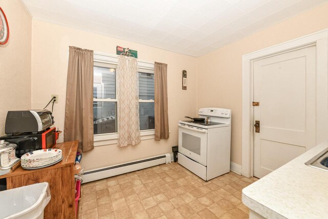 kitchen featuring white electric range and baseboard heating