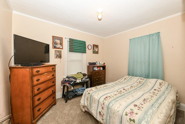 carpeted bedroom featuring ornamental molding