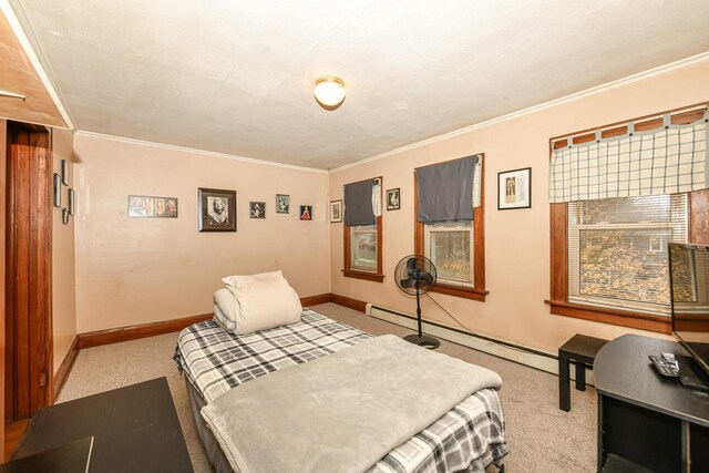 bedroom featuring a textured ceiling, light colored carpet, baseboard heating, and crown molding