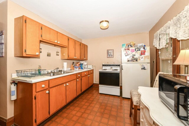 kitchen with white appliances and sink