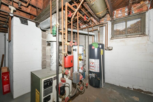 utility room featuring gas water heater