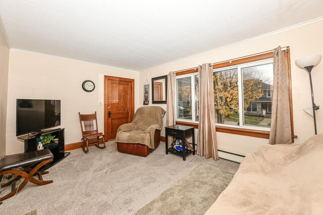 sitting room with crown molding, light carpet, and a baseboard radiator