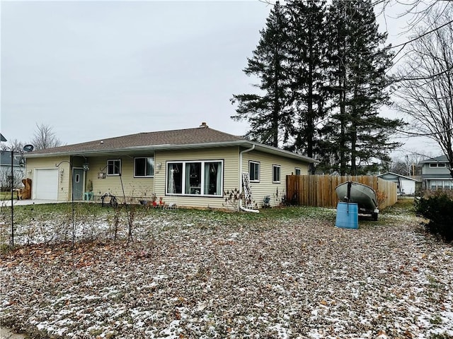 back of house with a garage