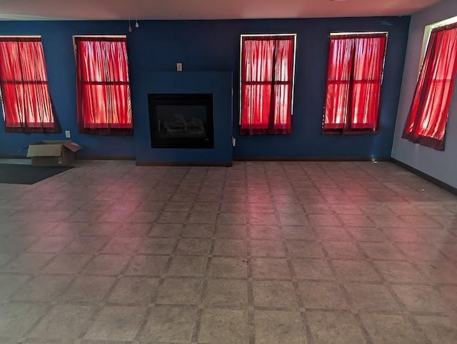 312 Railroad St, Norwalk, WI 54648 - unfurnished living room with baseboards, a fireplace, and tile patterned floors