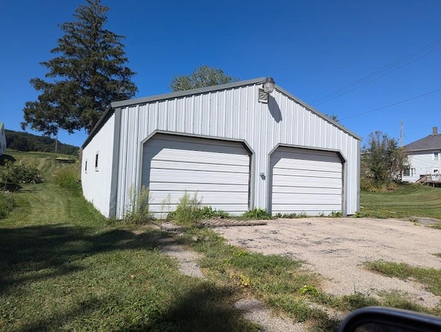 garage with a lawn