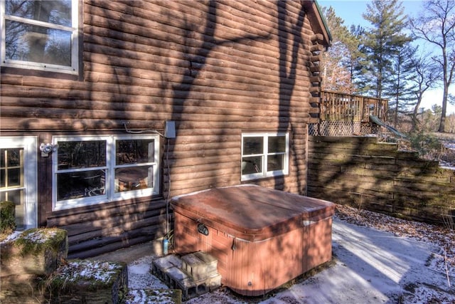 exterior space with a hot tub