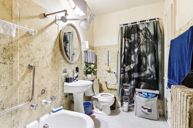 bathroom featuring shower / bath combo with shower curtain, toilet, radiator heating unit, and tile patterned flooring