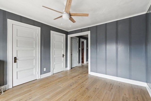 unfurnished bedroom with ceiling fan, light hardwood / wood-style floors, and ornamental molding