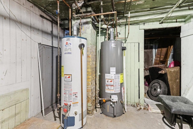 utility room featuring water heater