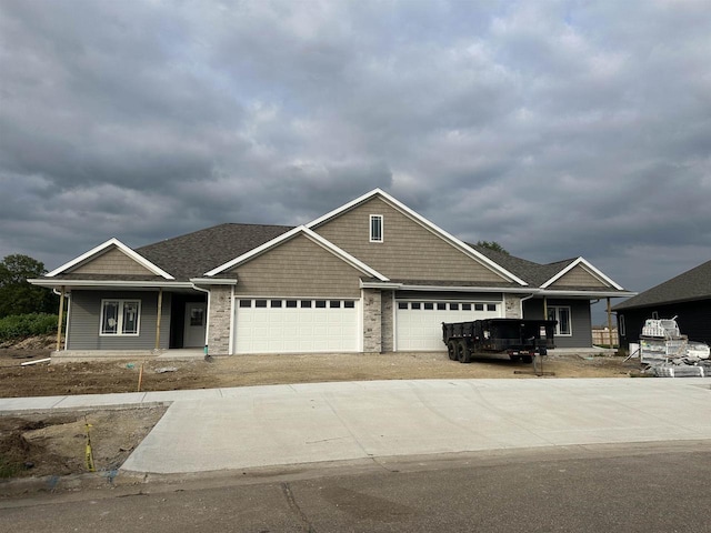 craftsman inspired home with a garage