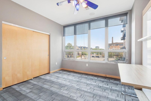 unfurnished bedroom with a closet and ceiling fan