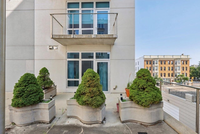 entrance to property with a balcony