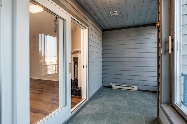 unfurnished sunroom with wooden ceiling