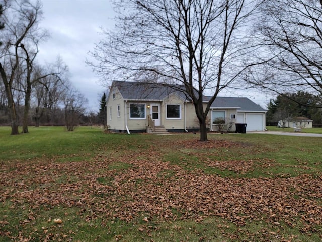 view of front facade with a front lawn and a garage