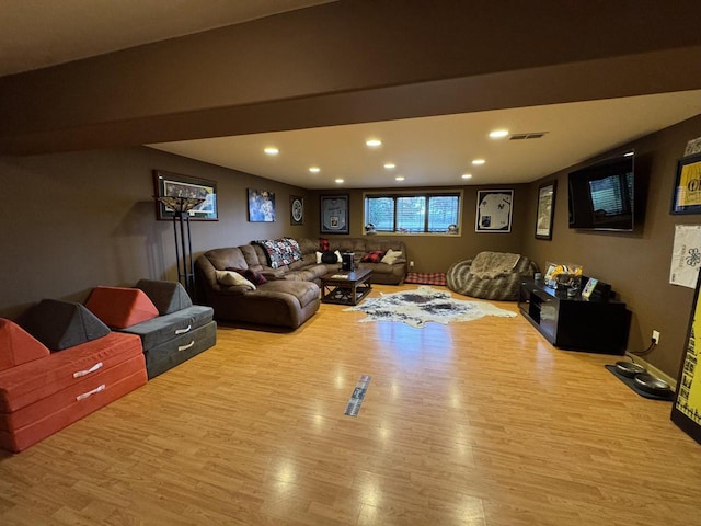 rec room with light hardwood / wood-style floors