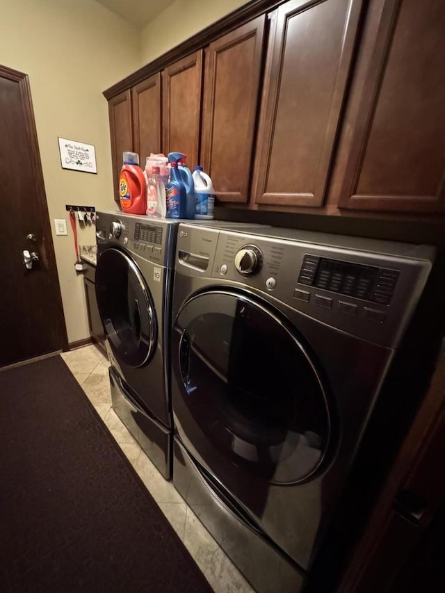 laundry area with cabinets and washer and dryer