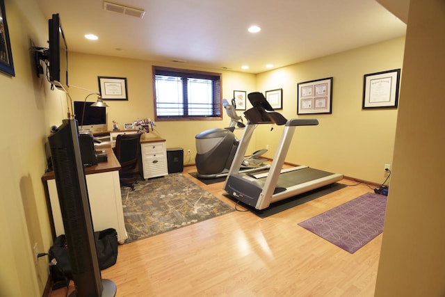 exercise area featuring light hardwood / wood-style flooring