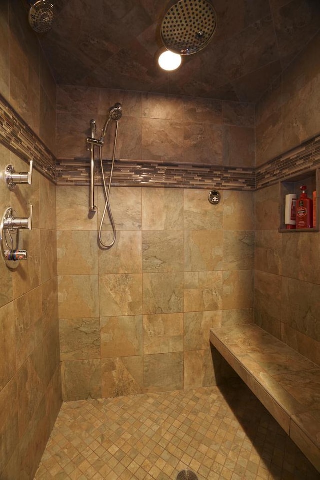 bathroom with a tile shower