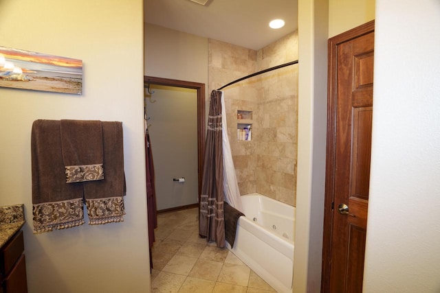 bathroom with tile patterned floors, vanity, and shower / tub combo with curtain