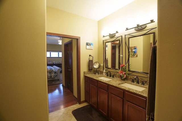 bathroom with tile patterned flooring and vanity