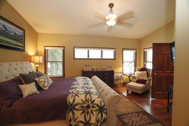 bedroom featuring ceiling fan, dark hardwood / wood-style flooring, and vaulted ceiling