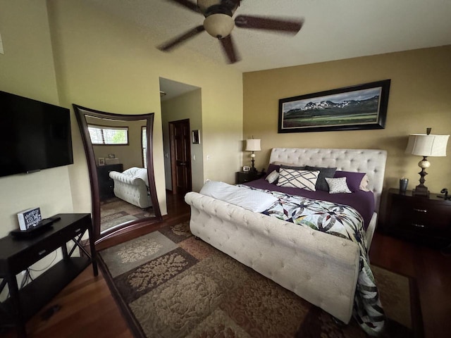 bedroom featuring ceiling fan and dark wood-type flooring